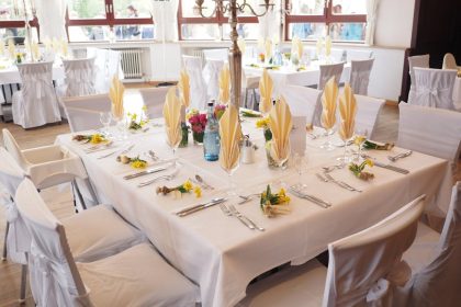 A beautifully decorated dining room table set for an elegant celebration indoors.